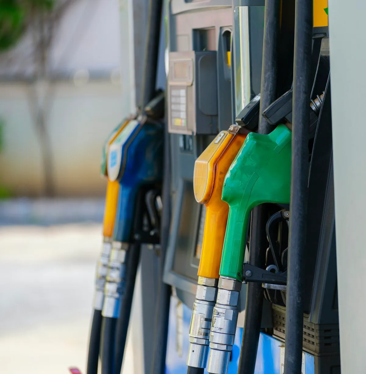 Petrol pump nozzles at a fuel station